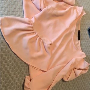 Pink blouse flared arms
